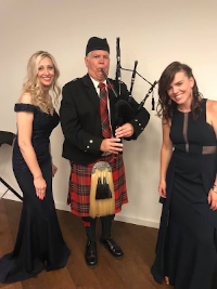 Detroit bagpiper with two guest